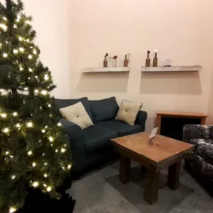 a living room with a christmas tree
