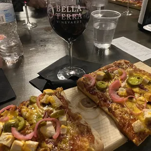 BBQ chicken flatbread with a glass of petite sirah