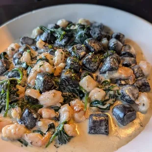 Squid ink gnocchi with cream sauce