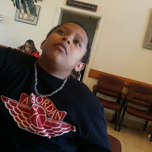 Bored watching tv waiting in waiting area its a full house