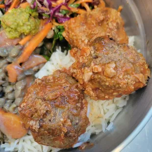 Meatball Rice bowl: 3 juicy all beef scratch made meatballs over rice and steamed kale. Pictured with a side of lentils and rainbow slaw