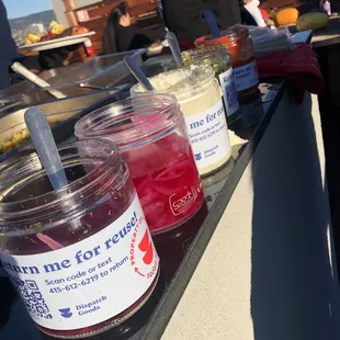 three jars of jam on a counter