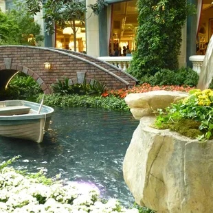 Lovely pond, bridge and rowboat.