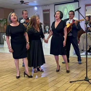 The birthday girl singing with the Marchis.