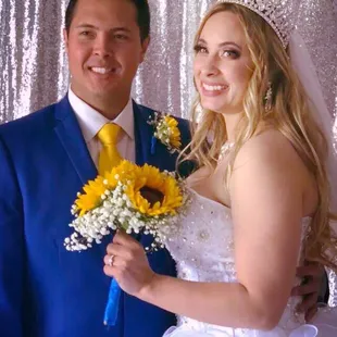 Bride and groom in front of photo area