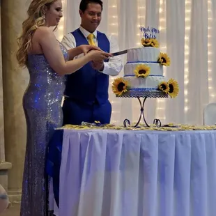 Bride &amp; Groom Cutting into their cake