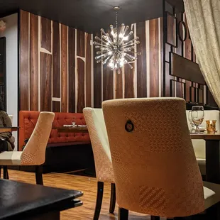 a dining room with wood paneled walls