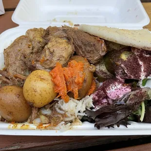 a meal in a styrofoam container