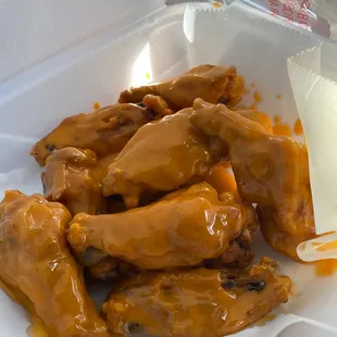 a plate of chicken wings