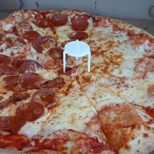 a pepperoni pizza in a box