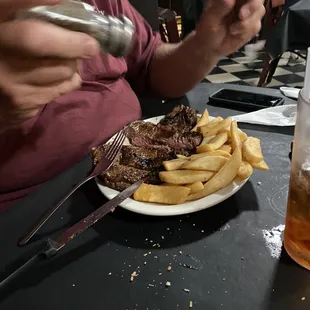 a plate of food and a glass of beer