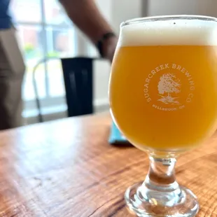 a glass of beer on a table