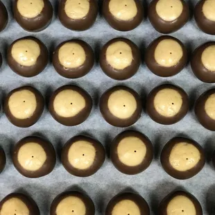 BUCKEYES ~ An Ohio tradition!  Creamy peanut butter centers dipped in our signature blend of chocolate.
