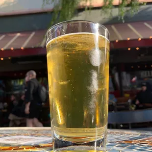 a glass of beer on a table