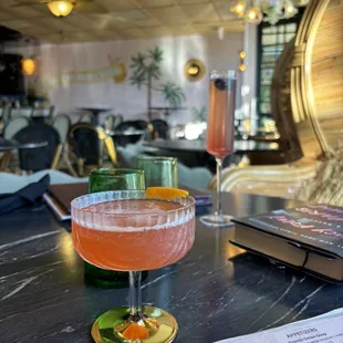 Cocktails with the bar in the background