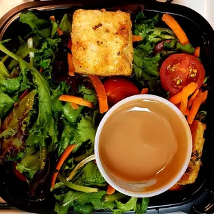 Side salad that accompanies breakfast burrito with homemade croutons and basalmic vinaigrette