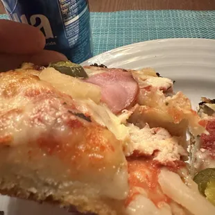 Ham and pineapple pizza, I pulled on the raw dough and you can see the thin amount at the bottom that was actually cooked.