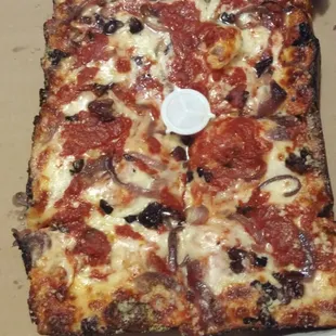 Large Detroit style deep dish with Kalamata olives, caramelized red onions and extra sauce!