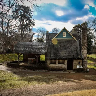a stone building with a slate roof