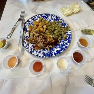 Pulled pork with fried okra and green beans as sides