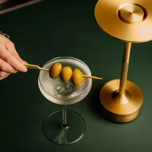 a martini with olives in it