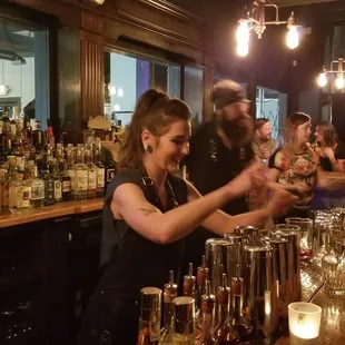 a bartender pouring a drink