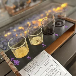 three glasses of wine on a tasting board