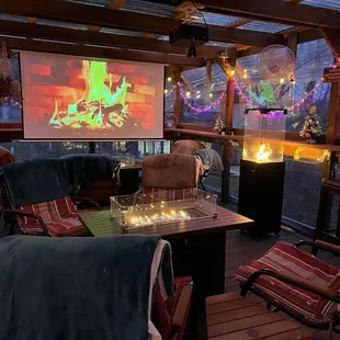 a patio with a fire pit