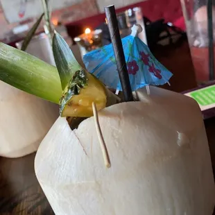 a coconut drink in a coconut bowl
