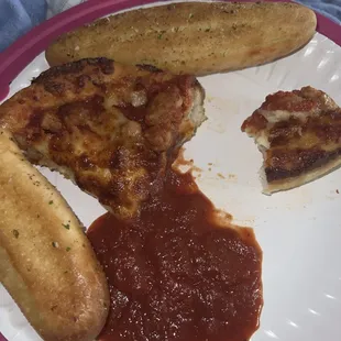 The slices of pizza (there were 4) and the garlic sticks.