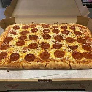 a pepperoni pizza in a box