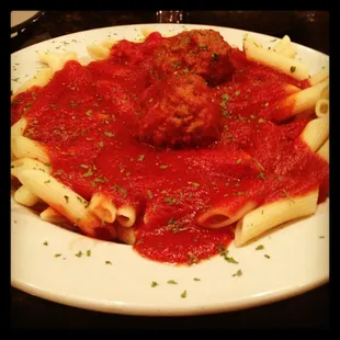 a plate of pasta and meatballs