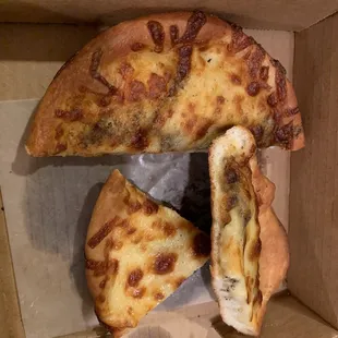 a half eaten pizza in a box
