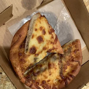 a slice of pizza in a box