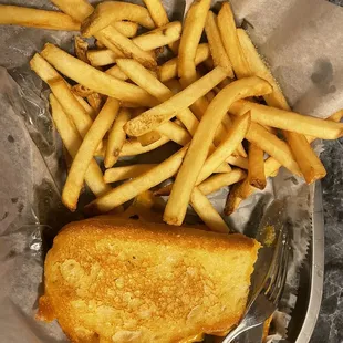 Grilled cheese and half order of fries (sorry I took a bite before taking a picture lol)