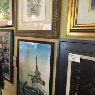 a woman looking at paintings