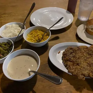 Chicken fried steak and homestyle sides.