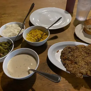 Chicken fried steak with family style sides