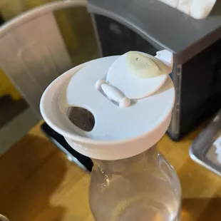 Mildew or water residue on the water container&apos;s lid. Its a rubber mouthpiece cover.