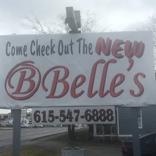 a sign that says come check out the new b belles