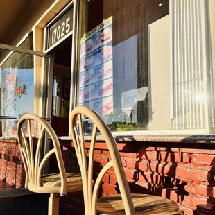 two chairs in front of a window