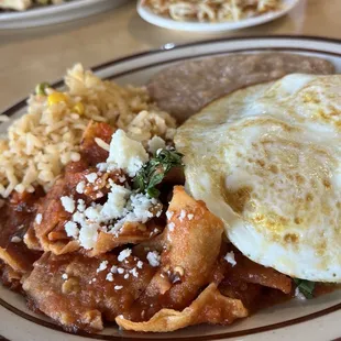 Chilaquiles- red and green (under the egg)- not small or large portions. Just right. Delicious , not mild or hot but definitely spicy