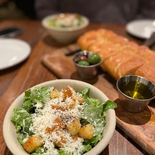 a bowl of salad and bread