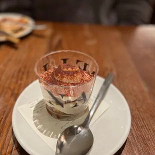 a dessert in a bowl with a spoon