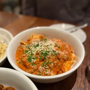 three bowls of food on a table