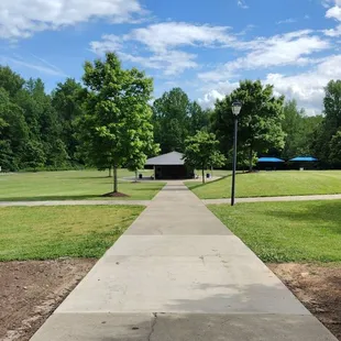 Bocce on the right, shuffle board to the left, potties under the roof