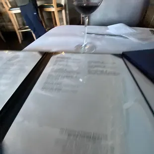 a glass of wine on a table