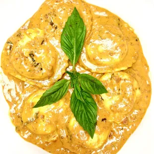 HOMEMADE LOBSTER RAVIOLI, served in vodka sauce!