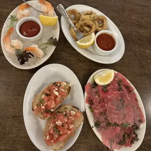 Shrimp Cocktail, Calamari Fritti - Crispy Fried Calamari, bruschetta, beef carpaccio for free with 2 drinks