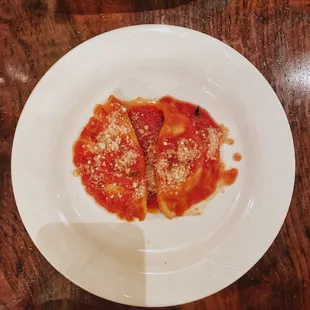 Ravioli di Ricotta Fresca -- Ravioli stuffed with fresh ricotta cheese served in San Marzano fondue